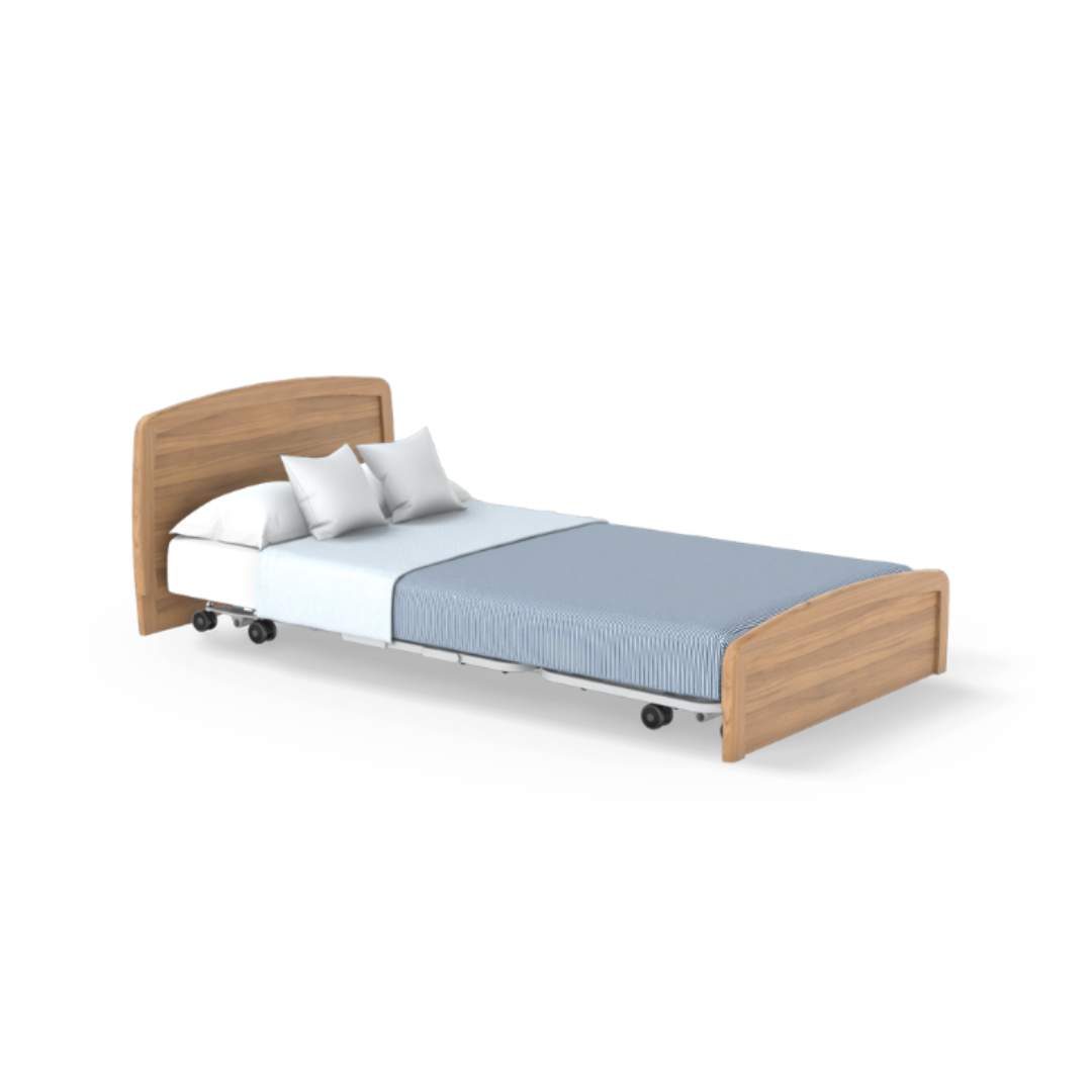 The Accora Empresa® Full Electric Bariatric FloorBed® features a wooden headboard and footboard, light blue striped blanket, white sheets, two white pillows, and wheels for mobility.