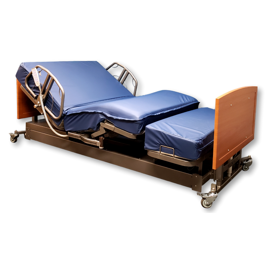 The Med-Mizer ActiveCare Rotating Hospital Bed features blue cushions, adjustable head and leg sections, metal rails, wood-finished headboard and footboard, plus wheels for mobility. Shown here in a partially elevated position.