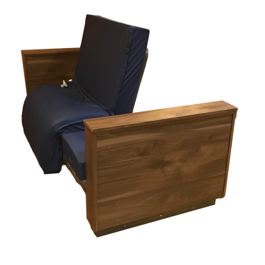 A wooden-framed recliner with dark blue cushions, shown from the back and side on a white background—perfectly suited for pairing with the Med-Mizer ActiveCare Rotating Hospital Bed in long-term care settings.