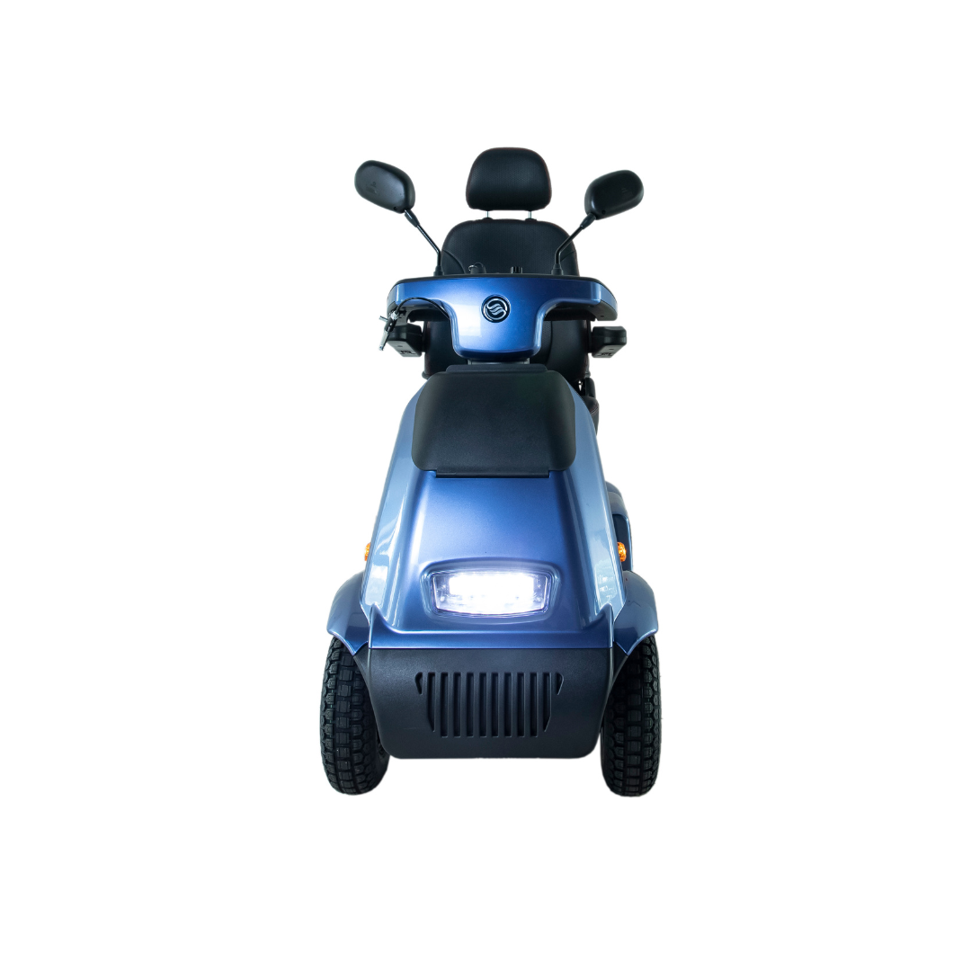Front view of the Afikim Afiscooter C4 HD, a blue electric 4-wheel mobility scooter with an illuminated headlamp. It has an orthopedic black seat and two side mirrors, showcasing its design against a plain white background.