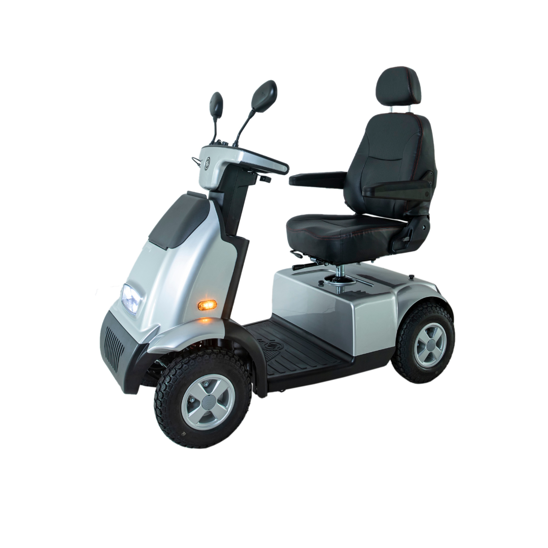The Afikim Afiscooter C4 HD 4-Wheel Mobility Scooter, silver with black accents, has a large cushioned orthopedic seat, armrests, and backrest. It comes equipped with a headlight and side mirrors to assist those with limited mobility in short-distance travel.