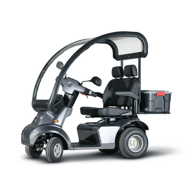 Explore the outdoors with the Afikim Afiscooter S4 HD Bariatric Mobility Scooter. Its durable dual-seat design features a sleek black frame, canopy, handlebars, storage box, and a transparent windshield. This three-wheeler offers exceptional all-terrain performance for your adventures.