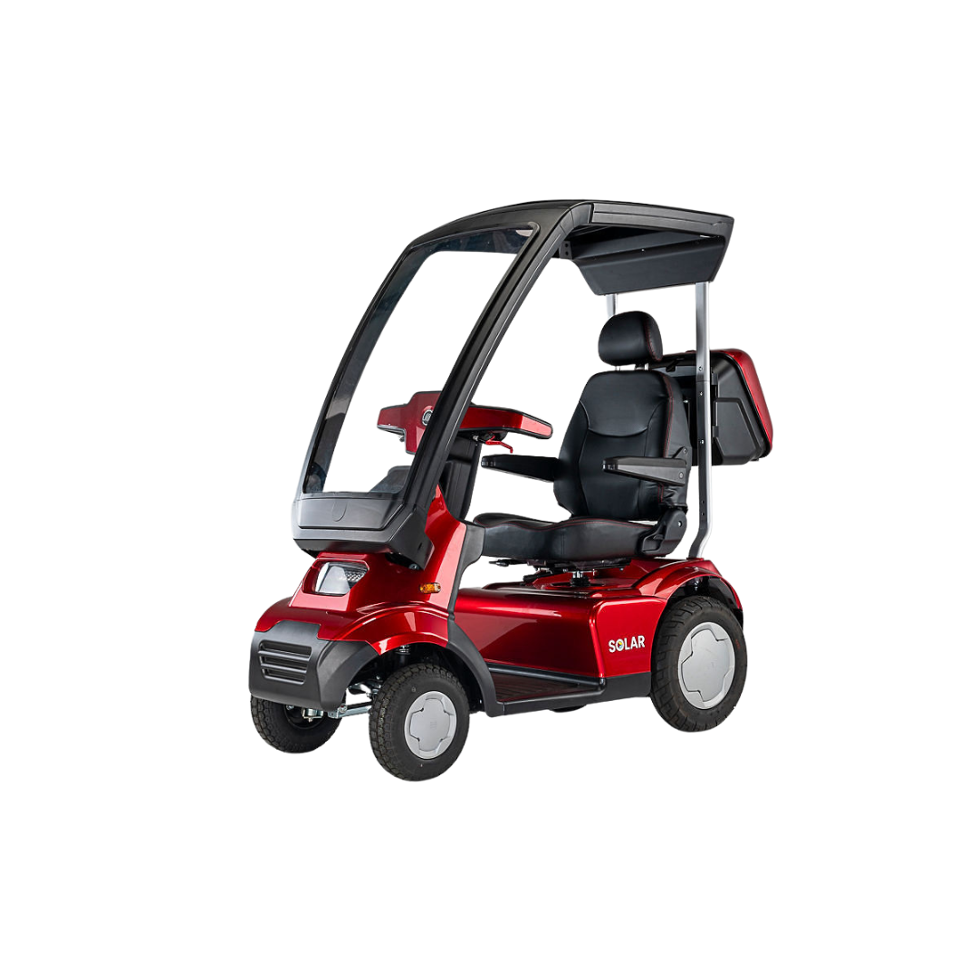 The Afikim Afiscooter Solar is a red solar-powered bariatric mobility scooter featuring an efficient solar charging system, clear canopy, black seat, rear storage, four wheels, and a sleek design promoting sustainable energy.