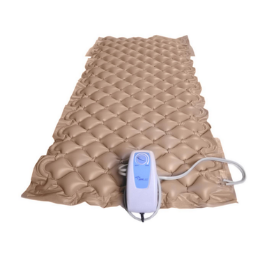 The Medline AirOne APP Alternating Pressure Pump and Pad, shown in beige with a textured bubble surface and an integrated whisper-quiet pump at the foot, is displayed against a plain white background.
