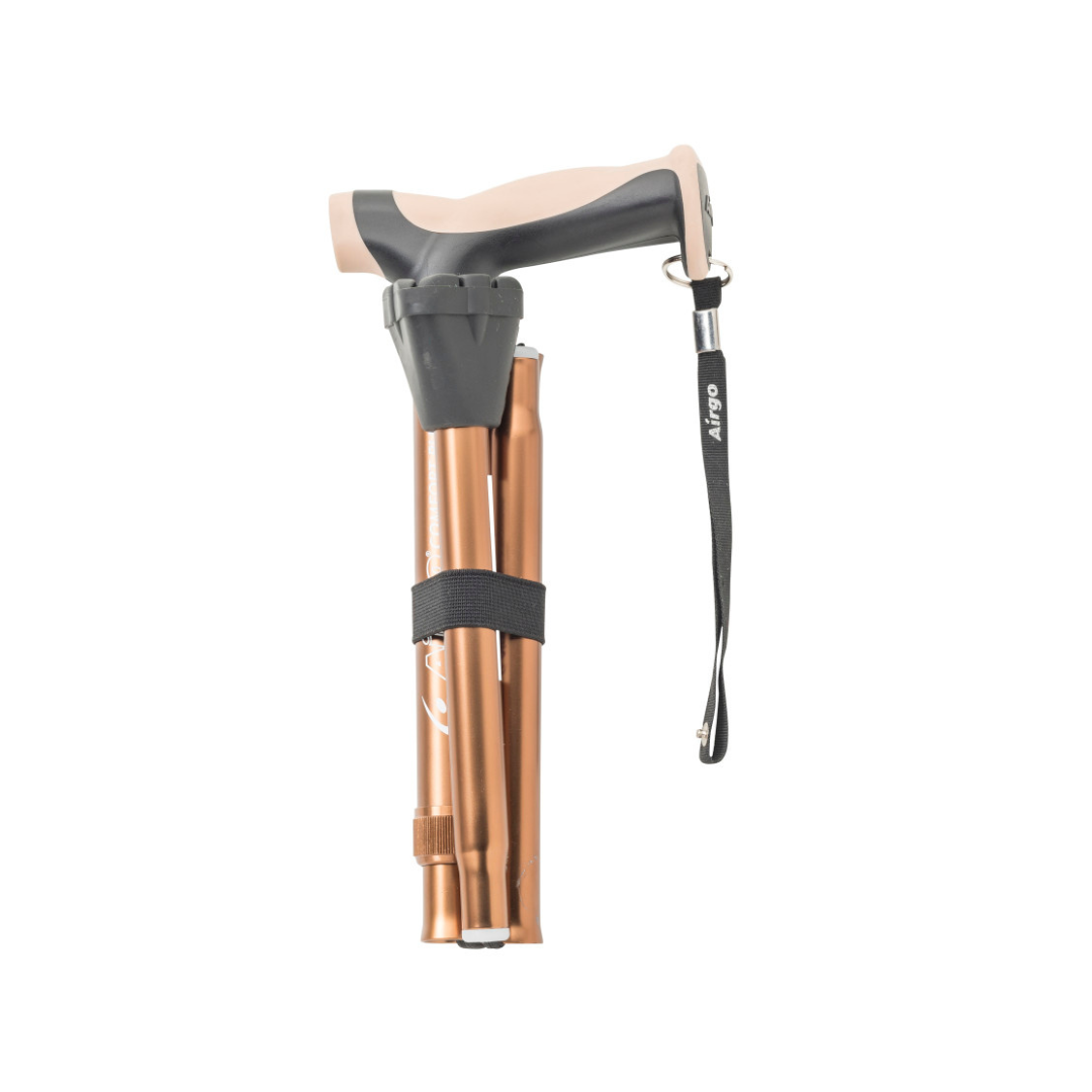 The Drive Airgo Comfort-Plus Folding Cane, shown on a white background, features a bronze finish, an arthritis-friendly beige ergonomic handle, black wrist strap, and a black strap securing its foldable sections.