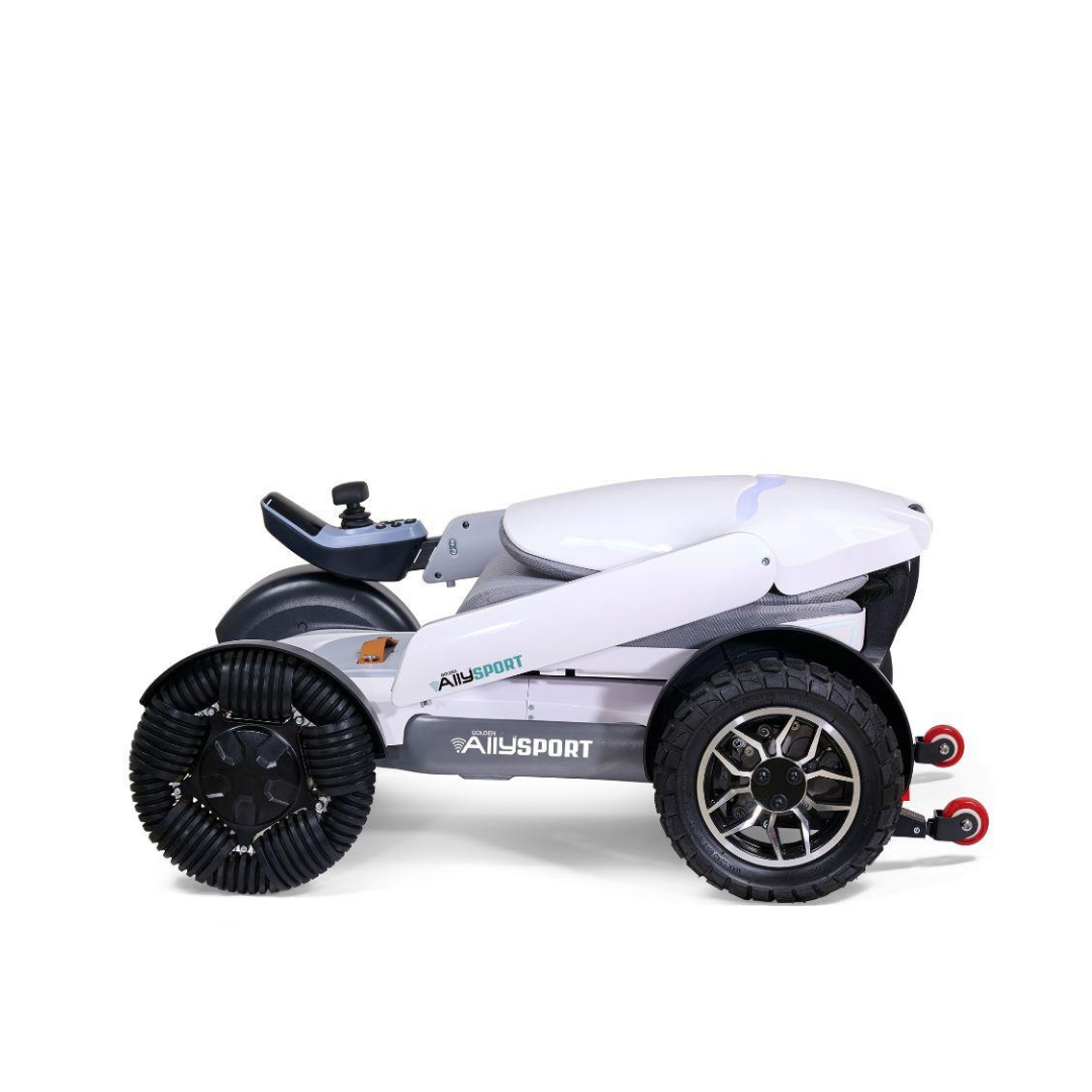The Golden Tech Ally Sport Smart Powerchair features a compact, foldable white frame, large black front omni-directional wheels, gray seat, red rear wheels, app control, and an armrest joystick for luxurious convenience.