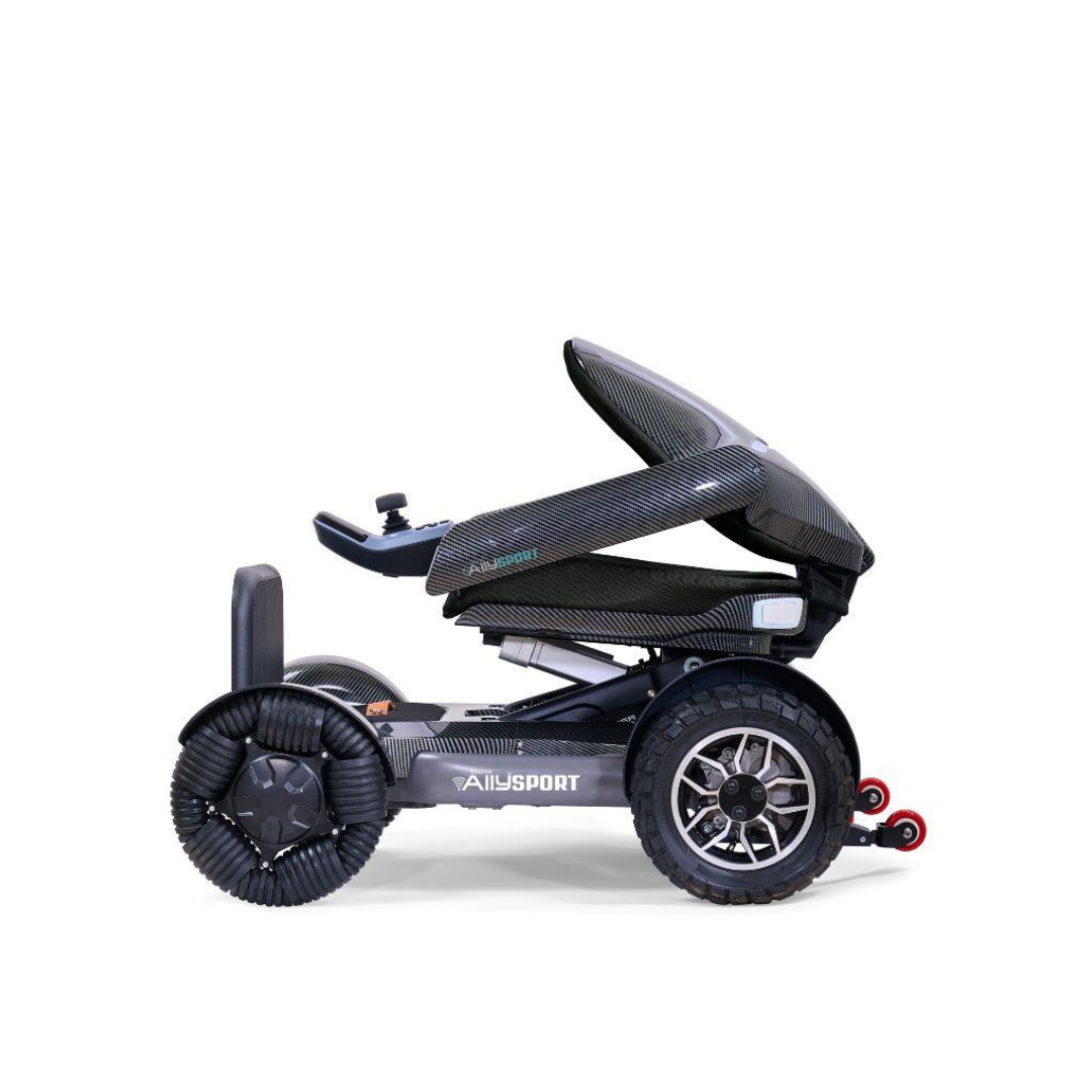The Golden Tech Ally Sport Smart Powerchair, featuring omni-directional wheels, app control, and a sleek modern design in black, is shown in profile against a white background.