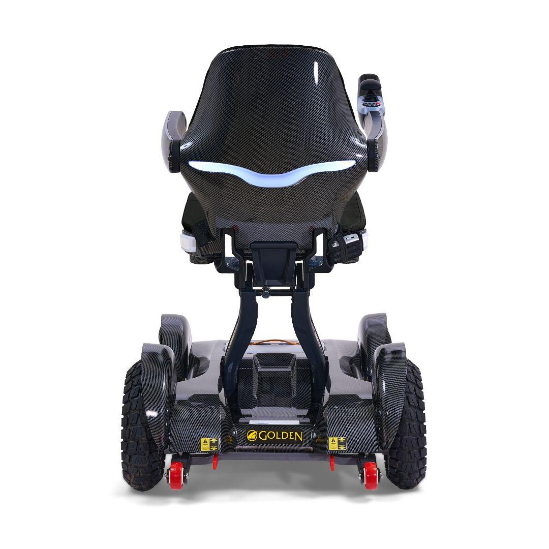 A rear view of a black Golden Tech Ally Sport Smart Powerchair featuring omni-directional wheels, ergonomic memory foam contoured seating, and the “Golden” brand name above the back bumper.