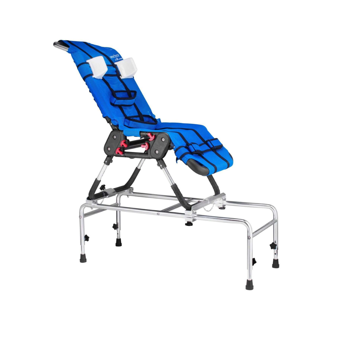 The Circle Specialty Pediatric Anchor Bath Chair features an adjustable blue design with headrests, secure straps, a sturdy metal frame, and rubber feet on four legs, ensuring safe, stable, and comfortable bathing for children with mobility needs.