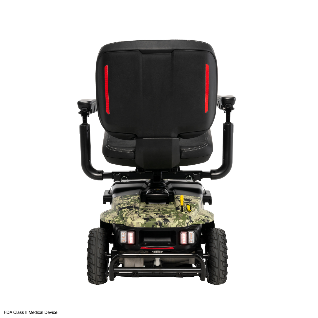 The Pride Baja® Bandit 4 Wheel Scooter features a camo-patterned base, sturdy wheels for off-road use, a black seat with red backrest accents, elevated armrests, rear lights, full suspension, and an FDA Class II Medical Device label.