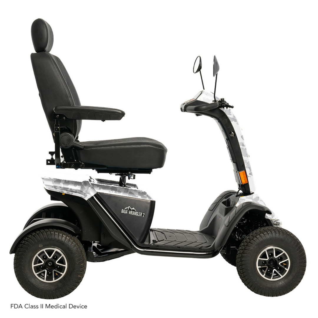 The Pride Baja® Wrangler® 2 Heavy Duty Outdoor Scooter boasts four sturdy wheels, a padded seat with headrest, adjustable armrests, handlebar mirrors, and textured footrests for safety and comfort. Its sleek black design makes it the perfect outdoor mobility solution.