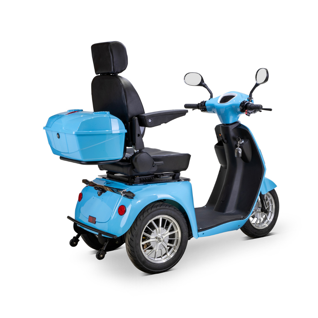 The Bespoke Elite Recreational 3-Wheel Scooter with Electric Brake Assist features a blue finish, high-backed seat, armrests, rear storage box, side mirrors, and digital speedometer—ideal for tall riders—shown from the back left side.