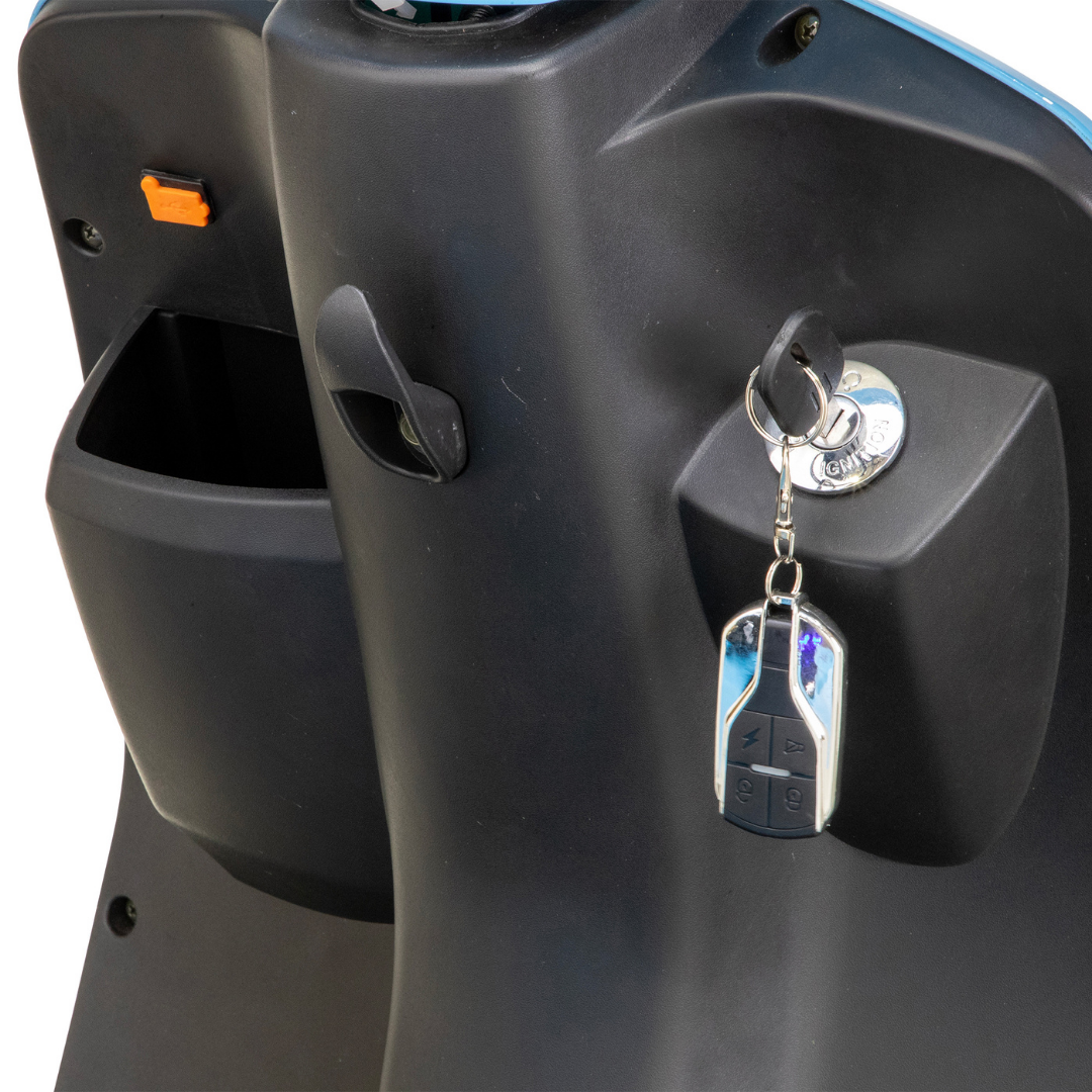 Close-up of the Bespoke Elite Recreational 3-Wheel Scooter’s black dashboard featuring a digital speedometer, key with remote fob in the ignition, open storage compartment, and convenient bag hook.