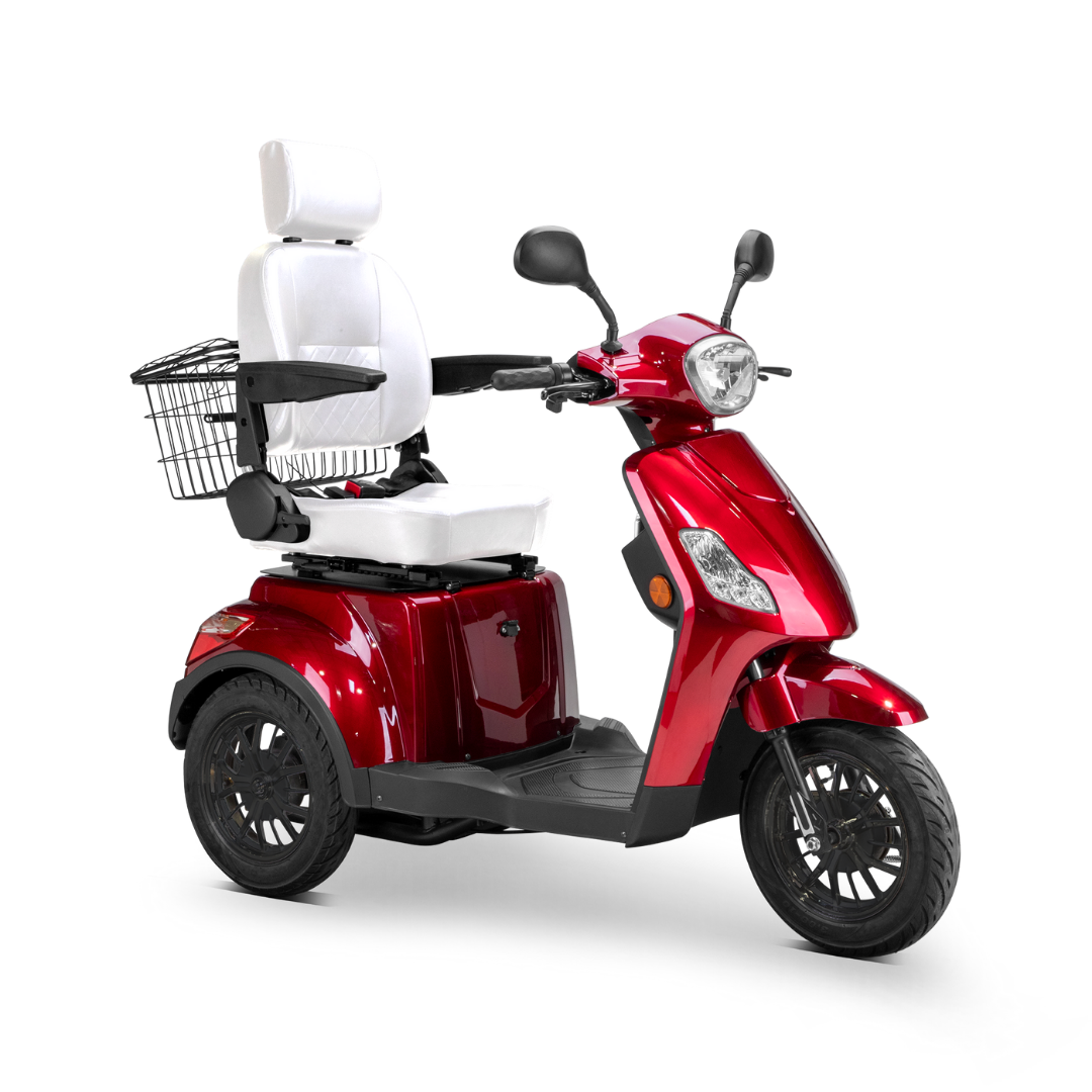 The Bespoke Legacy Recreational 3-Wheel Scooter is shiny red, with a tall white cushioned seat, black armrests and handlebars, front electric lights, and a rear wire basket.