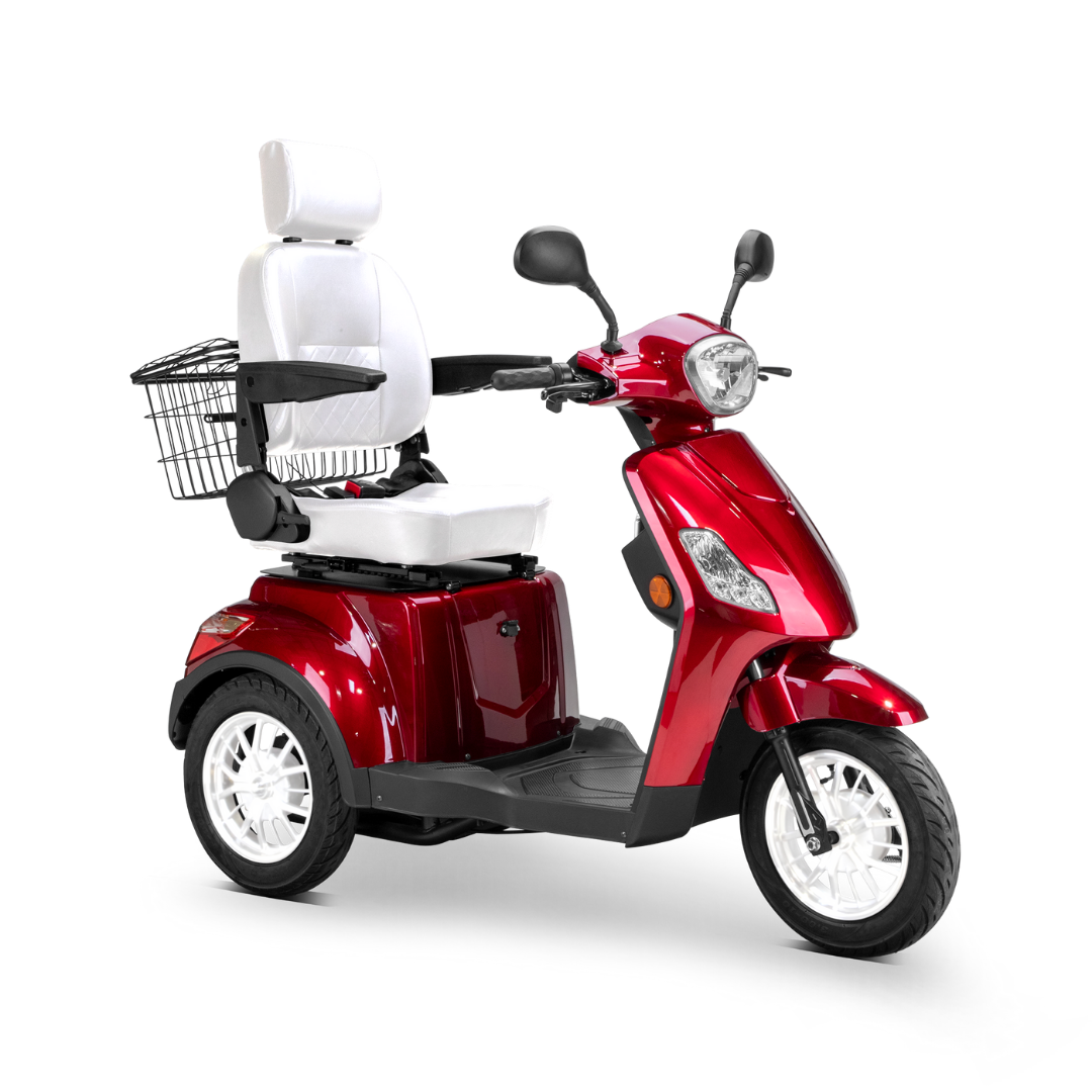 The Bespoke Legacy Recreational 3-Wheel Scooter is red with a 600-watt motor, white cushioned seat and wheels, metal rear basket, handlebars, and electric lighting system, displayed on a plain white background.