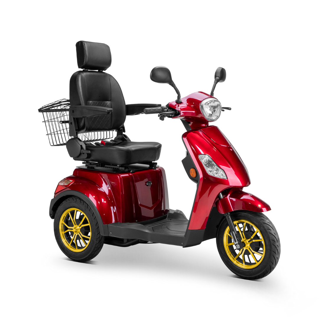 The Bespoke Legacy Recreational 3-Wheel Scooter is red with a 600-watt motor, black cushioned seat, headrest, armrests, rear metal basket, and gold-colored wheels, shown against a white background.