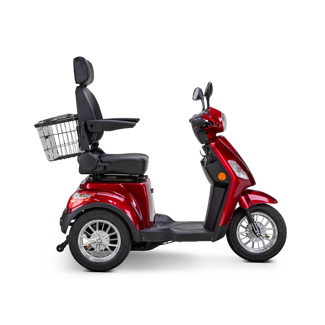 The Bespoke Legacy Recreational 3-Wheel Scooter is red with a 600-watt motor, black cushioned seat and headrest, handlebars, and a rear metal basket—shown in profile against a white background.