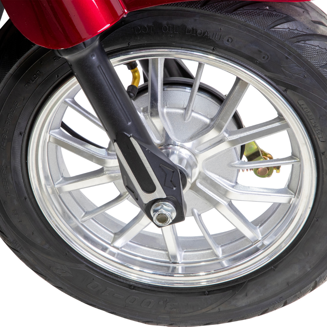 Close-up of a silver alloy wheel with a black fork and thick rubber tire, part of the Bespoke Legacy Recreational 3-Wheel Scooter, against a white background.