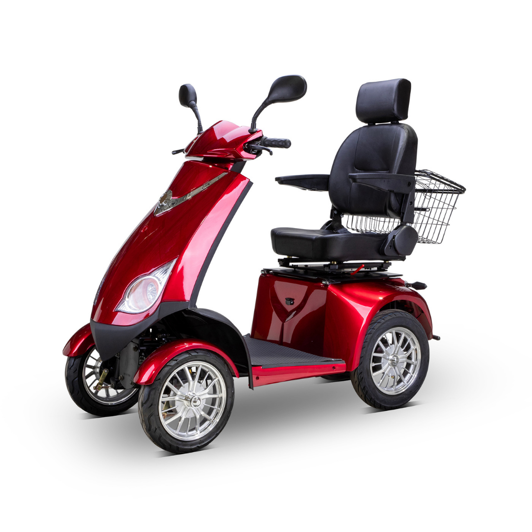 The Bespoke Platinum Recreational 4-Wheel Scooter with Electric Brake Assist features a glossy red finish, padded seat with backrest and armrests, rearview mirrors, and a wire basket on the back, shown against a white background.