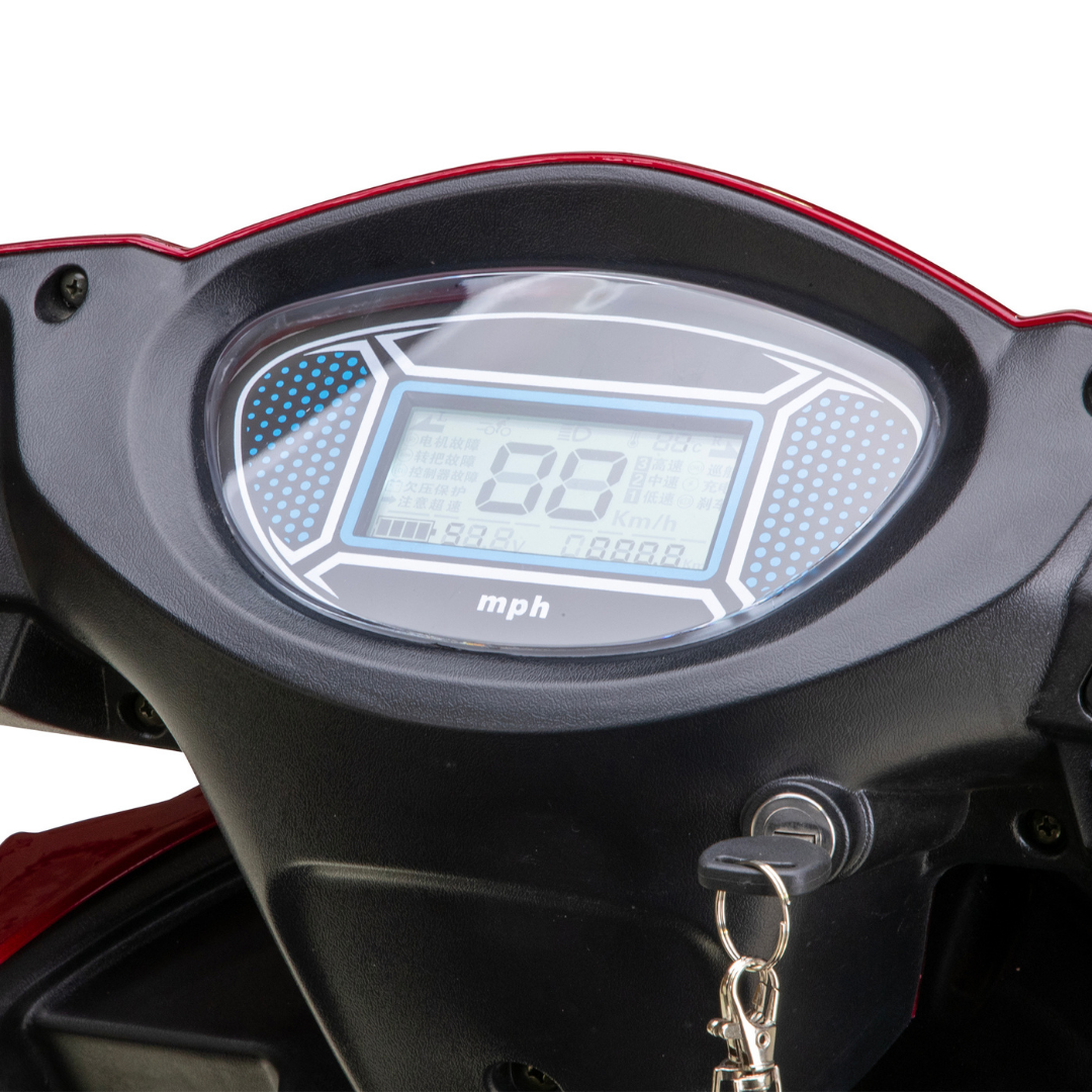 Close-up of the Bespoke Platinum Recreational 4-Wheel Scooter’s black dashboard with red accents, showing its digital speedometer at 0.0 mph and a key in the ignition, highlighting smart technology and electric brake assist features.