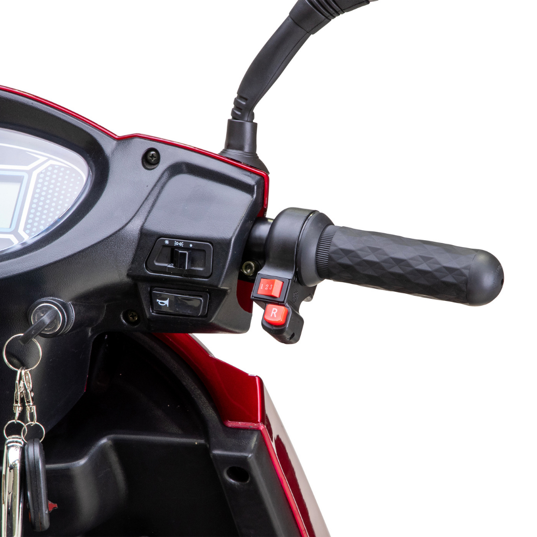 Close-up of the right handlebar on the Bespoke Platinum Recreational 4-Wheel Scooter with Electric Brake Assist, showing the grip, smart electronic controls, dashboard, ignition keys, and two red buttons labeled F and R.