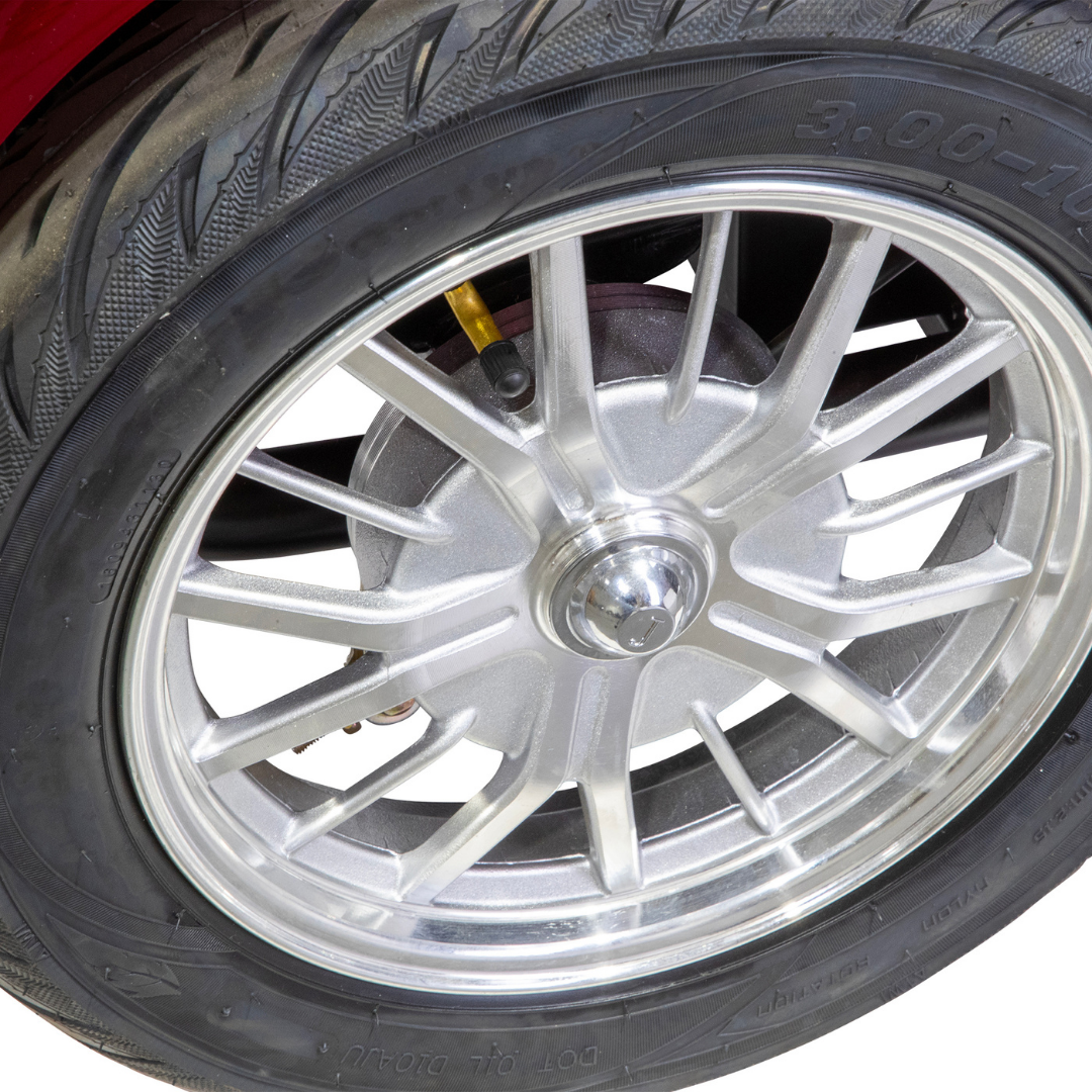 Close-up of the Bespoke Platinum Recreational 4-Wheel Scooters alloy wheel and tire, showing detailed tread and electric brake assist hubcap—ideal for high-performance or smart technology enthusiasts.