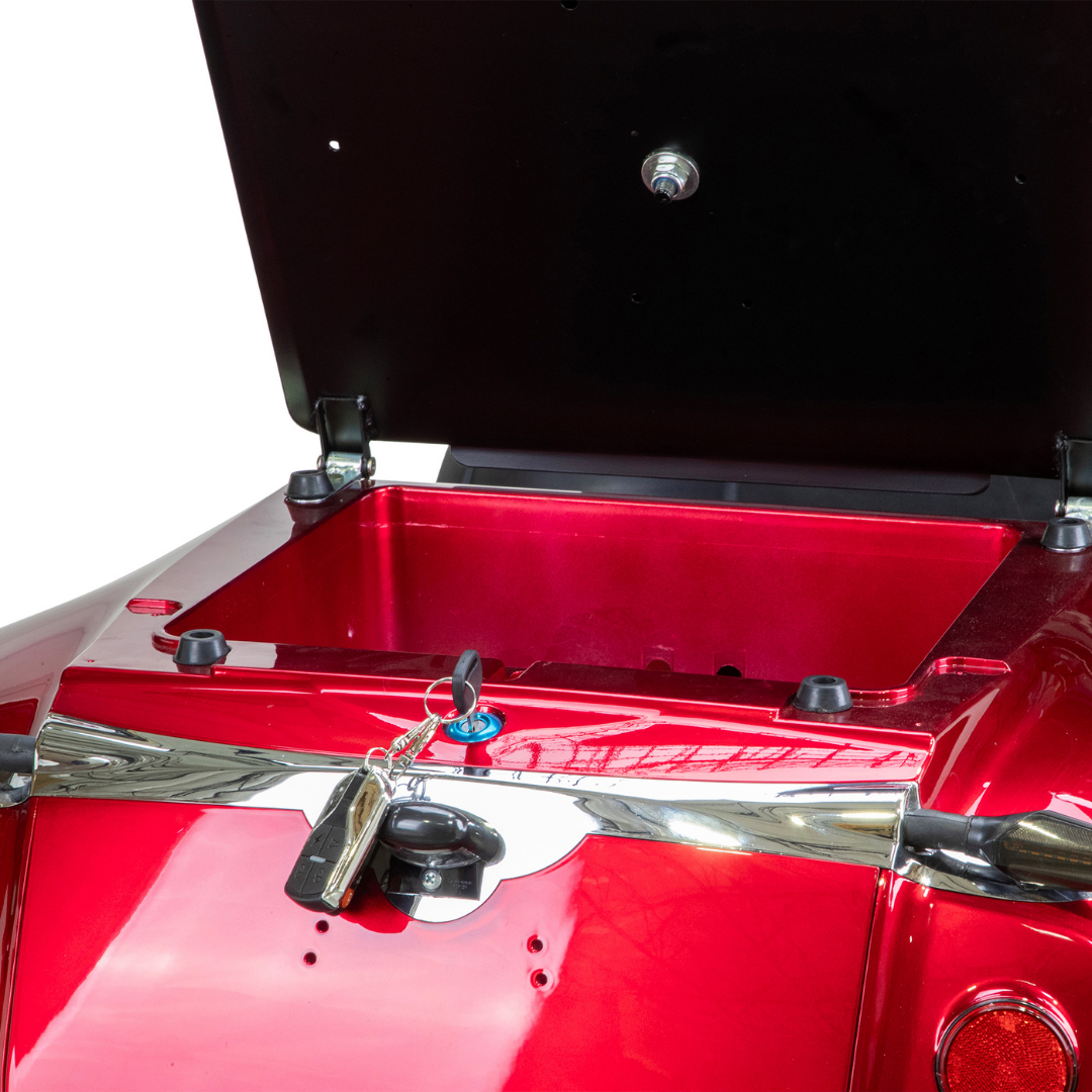 A close-up of the Bespoke Platinum Recreational 4-Wheel Scooter with Electric Brake Assist shows its shiny red finish, open rear storage compartment, and key in the lock, highlighting its convenient trunk access for users.