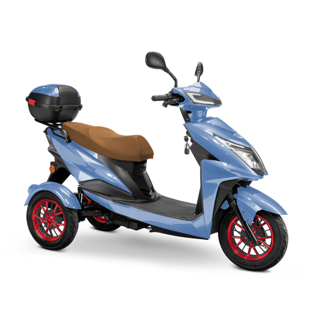 The Bespoke Regal Recreational 3-Wheel Scooter features a light blue body, 600-watt motor, brown seat, red-rimmed wheels, rearview mirrors, and a black storage box at the back, displayed on a white background.