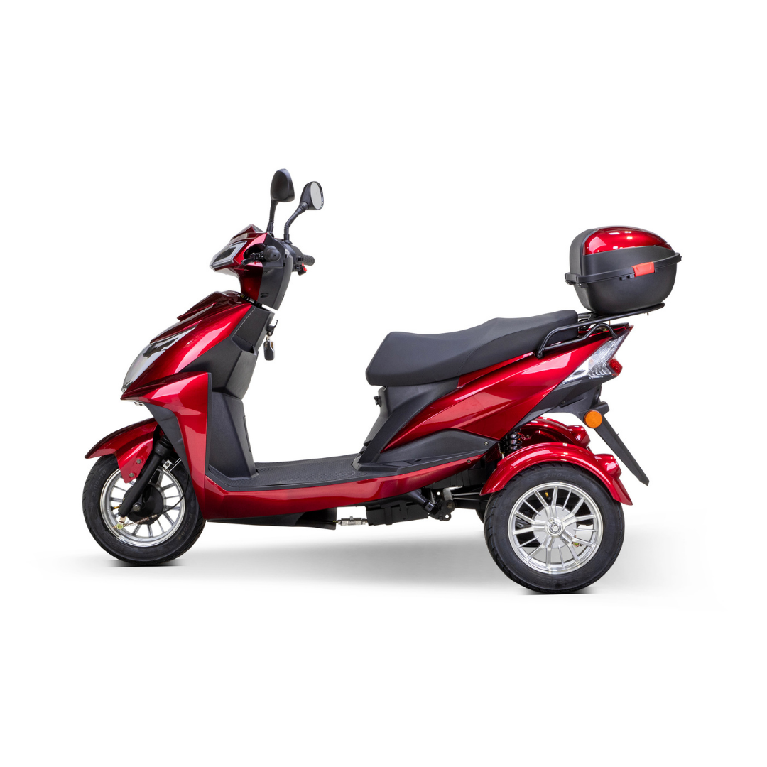 The Bespoke Regal Recreational 3-Wheel Scooter is a shiny red electric scooter with a 600-watt motor, black seat, handlebar mirrors, and rear storage box, shown from the side on a white background.