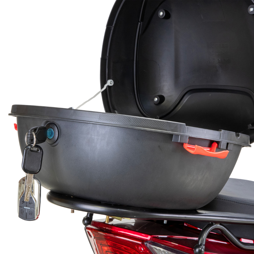 A black top case with a red latch is open and empty atop a Bespoke Regal Recreational 3-Wheel Scooter. A key is in the lock, extra keys hang from it, and the scooter features an advanced alarm system.