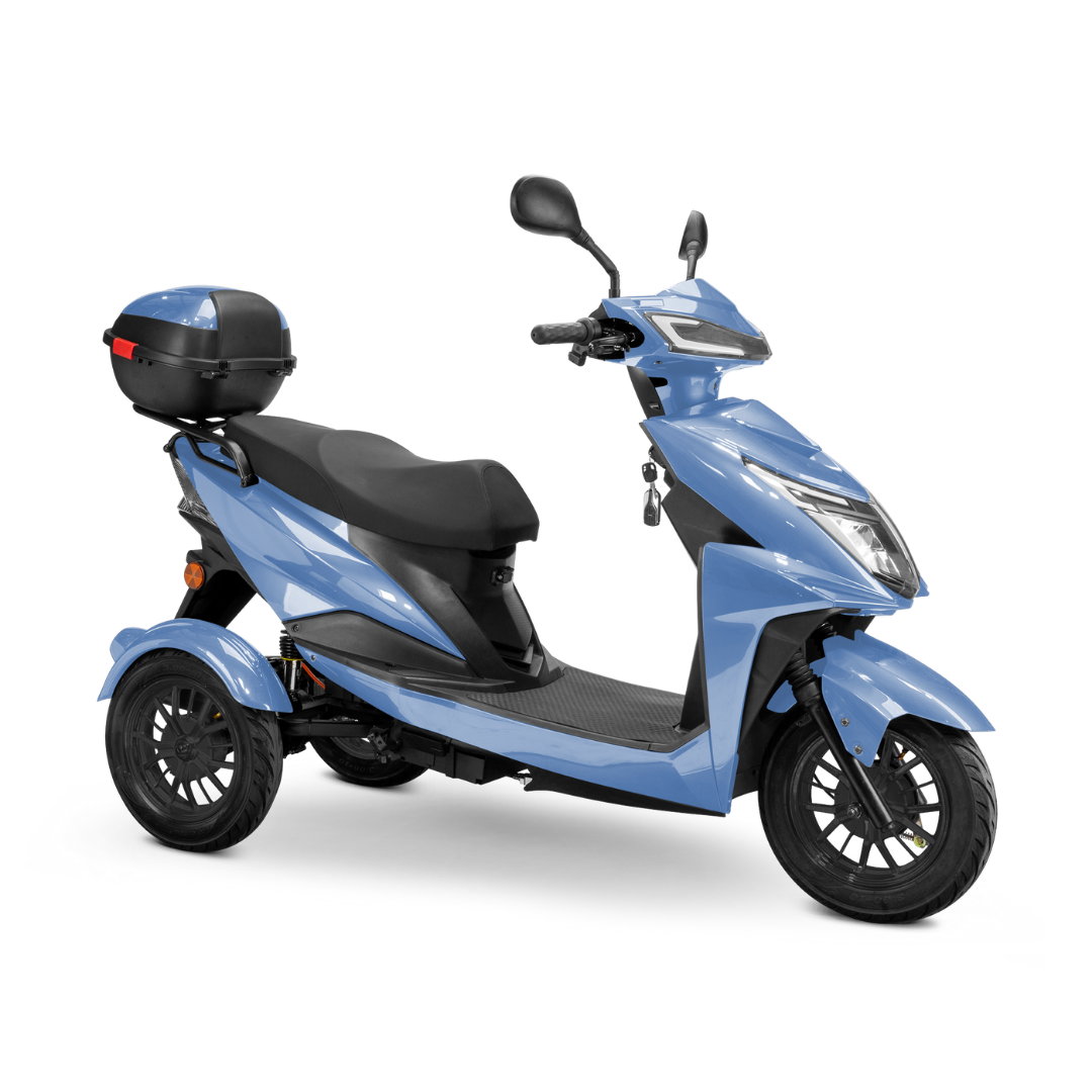 The Bespoke Regal Recreational 3-Wheel Scooter in light blue features a black seat, handlebar mirrors, advanced alarm, rear storage box, modern angular headlights, and a 600-watt motor, shown from a front-side angle on a white background.