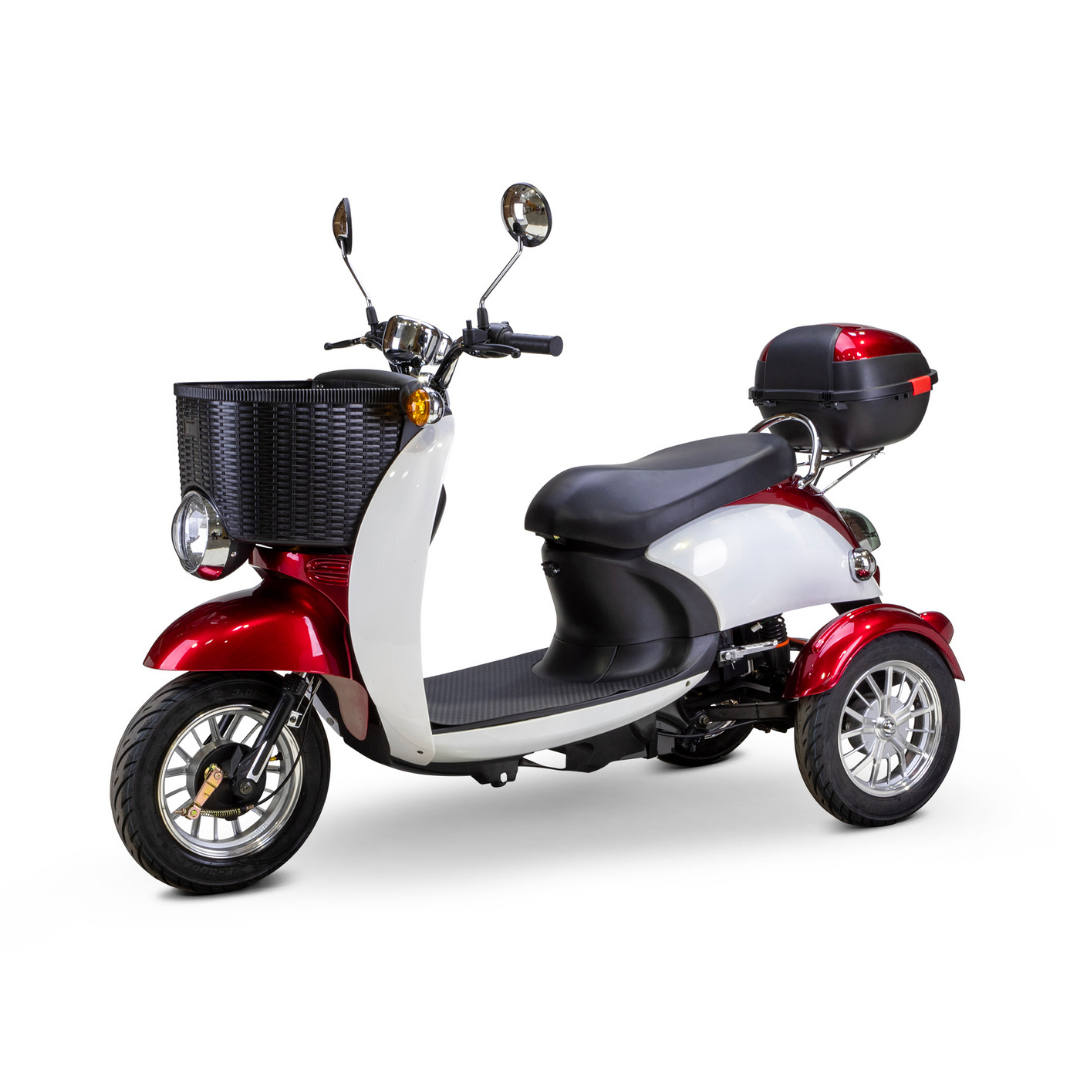 The Bespoke Supreme Euro-Style Recreational 3-Wheel Scooter with Electric Brake Assist features a 600-watt motor, red and white design, black front basket, side mirrors, padded seat, and rear storage box, shown on a white background.