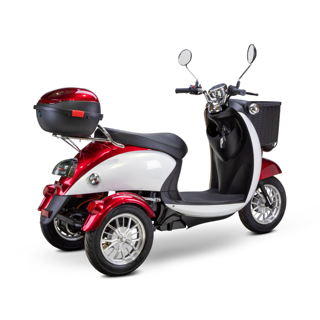 The Bespoke Supreme Euro-Style Recreational 3-Wheel Scooter with Electric Brake Assist features a 600-watt motor, red and white body, black seat, rear storage box, front basket, and two rearview mirrors, shown on a white background.