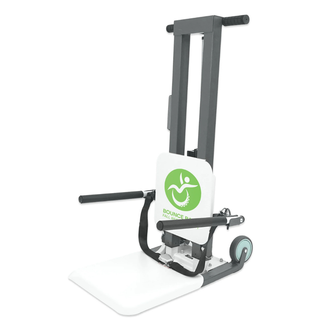 The Climbing Steps Bounce Back Fall Recovery Bariatric Patient Floor Lift is a white and gray portable lift with wheels, handlebars, a footplate, padded backrest, and the green Bounce Back Health logo—ideal for independent living.