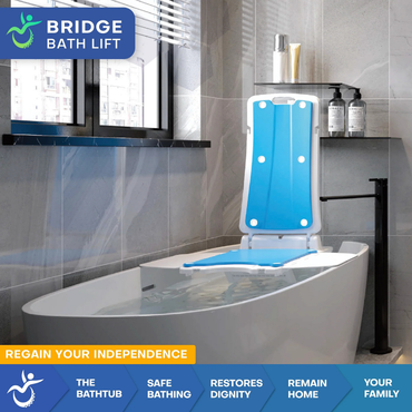 A modern bathroom with a white bathtub features a blue and white bathlift chair. Text highlights the Mobile Patient Lift Bridge Bath Lift and Fall Recovery Lift, promoting safety, dignity, and independence for families with limited mobility.