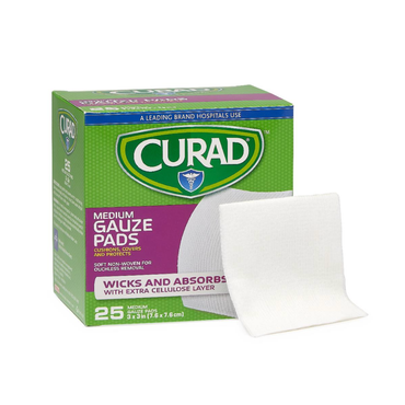 A green and purple box of Medline CURAD Sterile Pro-Gauze Pads with a white sterile pad in front; the box shows 25 pads, each 3 x 3 inches, designed for wicking and absorbing in wound care.