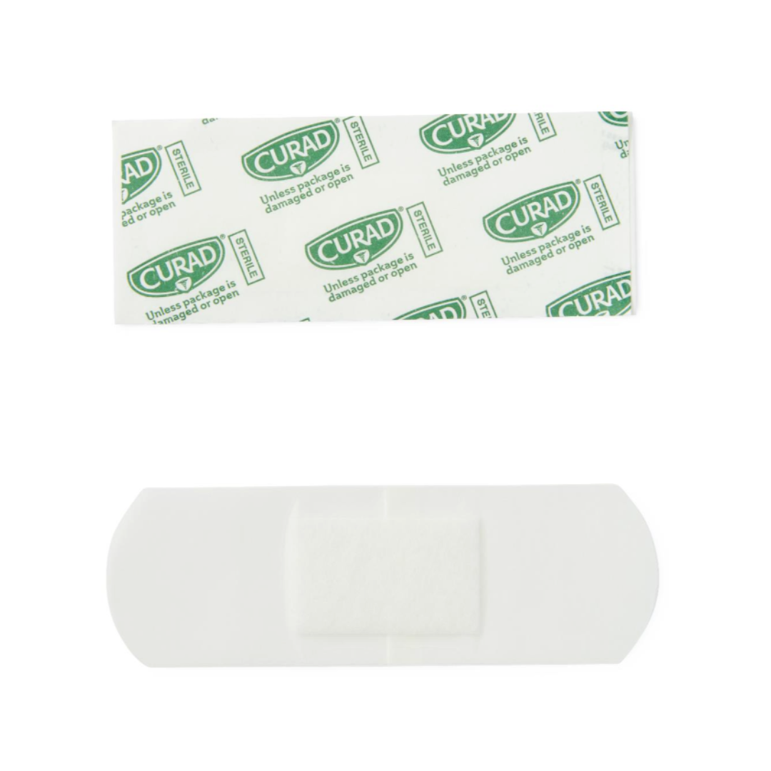 A CURAD Waterproof Bandage (1" x 3") with a 4-sided seal and its opened green-and-white wrapper are displayed on a white background, showcasing secure wound protection.