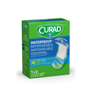 A green CURAD Waterproof Bandages box (1" x 3") contains 100 bandages with a 4-sided seal for wound protection. The packaging features text in English, French, and Spanish.