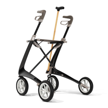 A sleek, modern black and gray byACRE Ultralight Carbon Fiber Rollator features ergonomic handles, large wheels, and a built-in Cane Holder for wooden canes—a stylish upgrade for carbon rollators.