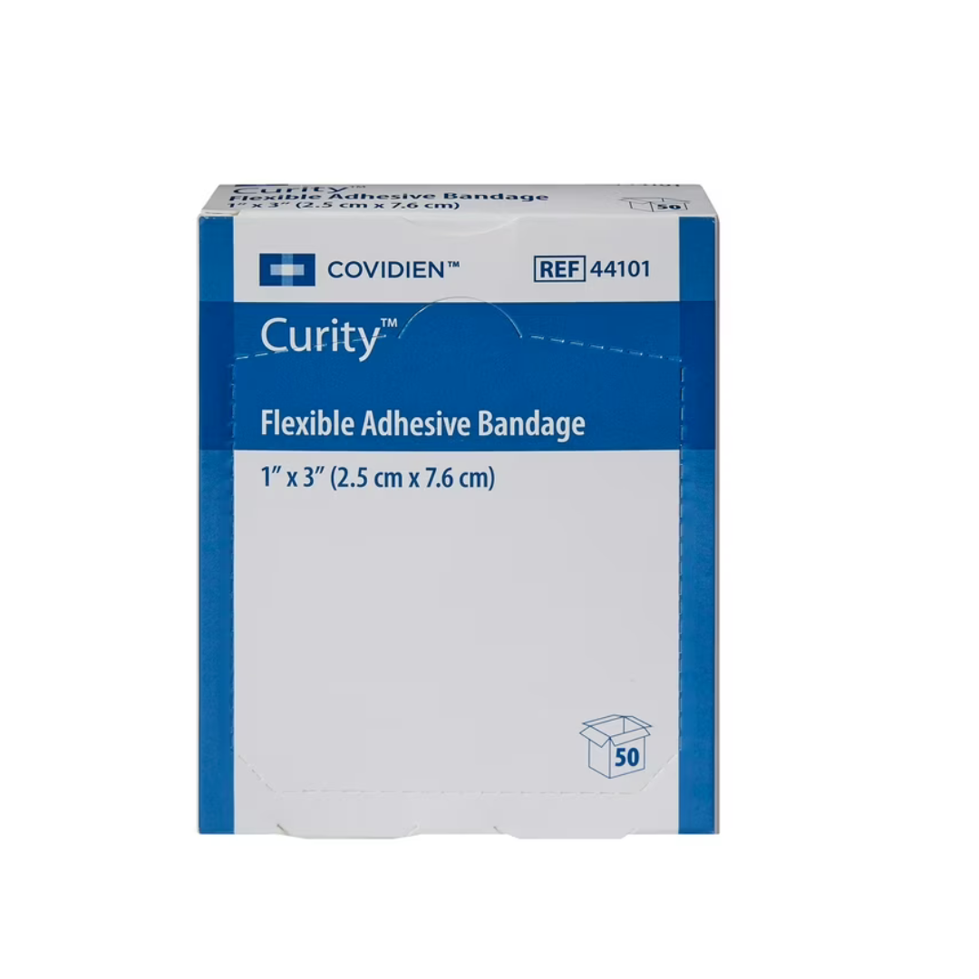 A box of Cardinal Curity™ Fabric Adhesive Flexible Bandages, 1" x 3", contains 50 bandages with Non-Stick Telfa Pads for wound protection. The mainly white box features blue accents and detailed product info.