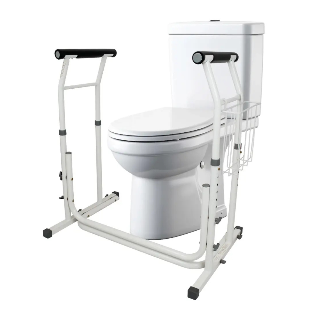 The Carex Stand-Alone Adjustable Toilet Safety Frame is a white toilet support frame with metal handles, designed to assist users with mobility needs. It features black foam grips and a side storage rack for added convenience.