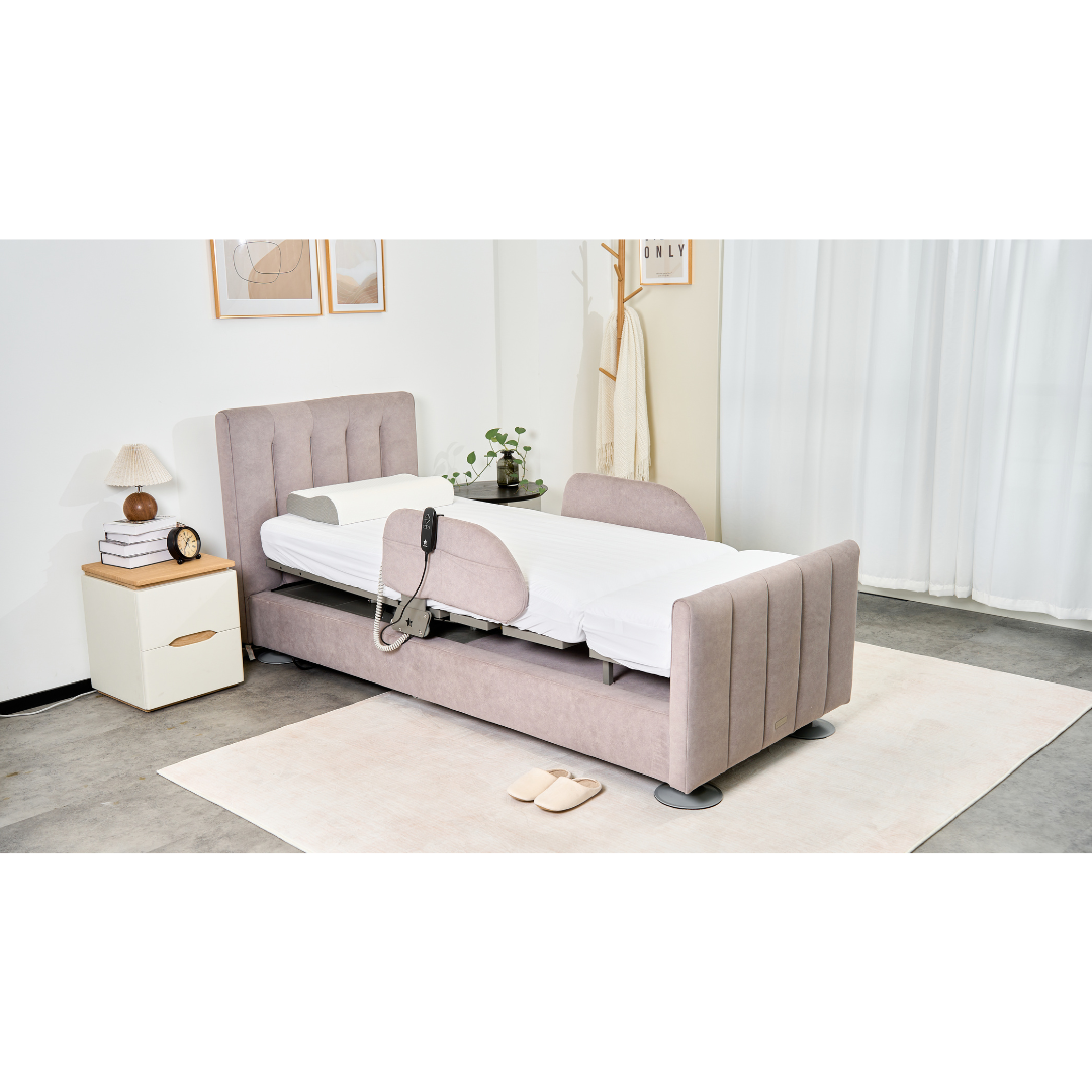 A modern bedroom with a Charme Starsleep Orin Rotating Full Electric Lift Assist Bed with Heat & Massage in beige, adjustable rail, a white nightstand and lamp, wall art, coat rack, slippers, potted plant on a light rug, and white curtains.