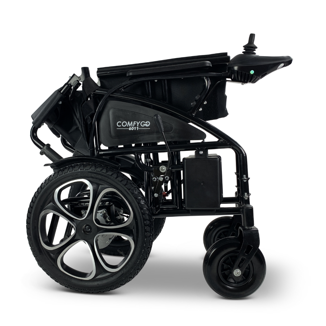 The ComfyGO 6011 Folding Electric Wheelchair, FAA approved, is a black lightweight design that folds compactly for easy portability. It has large rear and small front wheels with armrest control panels for maneuvering, and its frame prominently displays the ComfyGO name.
