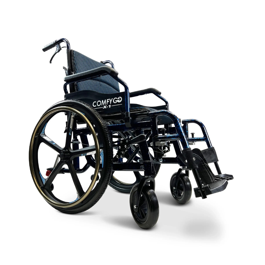 The black ComfyGo X-1 Lightweight Manual Wheelchair features a padded seat and backrest, gold-trimmed large rear wheels, smaller front wheels, and attached footrests. Its crafted with durable materials to enhance mobility and has quick-detach wheels for convenience.