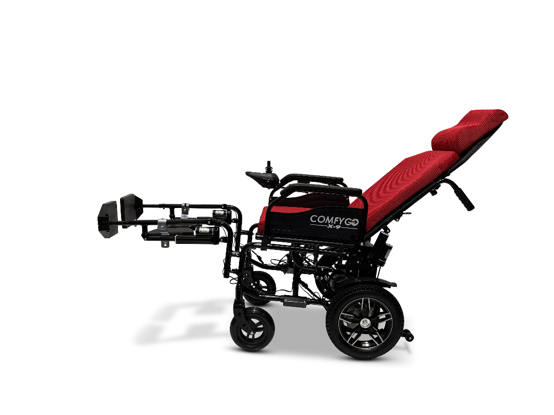 The ComfyGo X-9 Remote Controlled Powerchair, available in a sleek red and black design, features an automatic reclining backrest and leg support. Its large rear and nimble front wheels ensure exceptional mobility and comfort, while the remote control offers effortless operation.