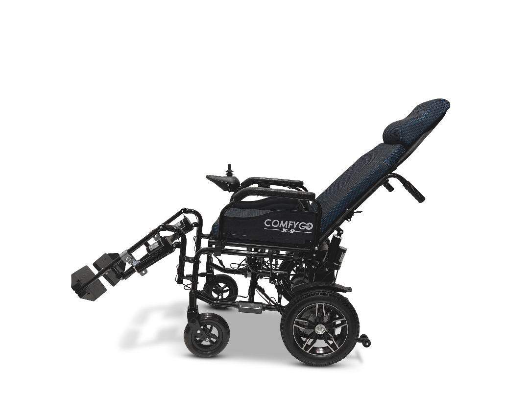 The ComfyGo X-9 Remote Controlled Powerchair boasts a sleek black and blue design with adjustable backrest and leg support. Featuring large rear wheels, smaller front wheels, and a brand logo on the side, it offers enhanced comfort and mobility in an ideal electric wheelchair solution.