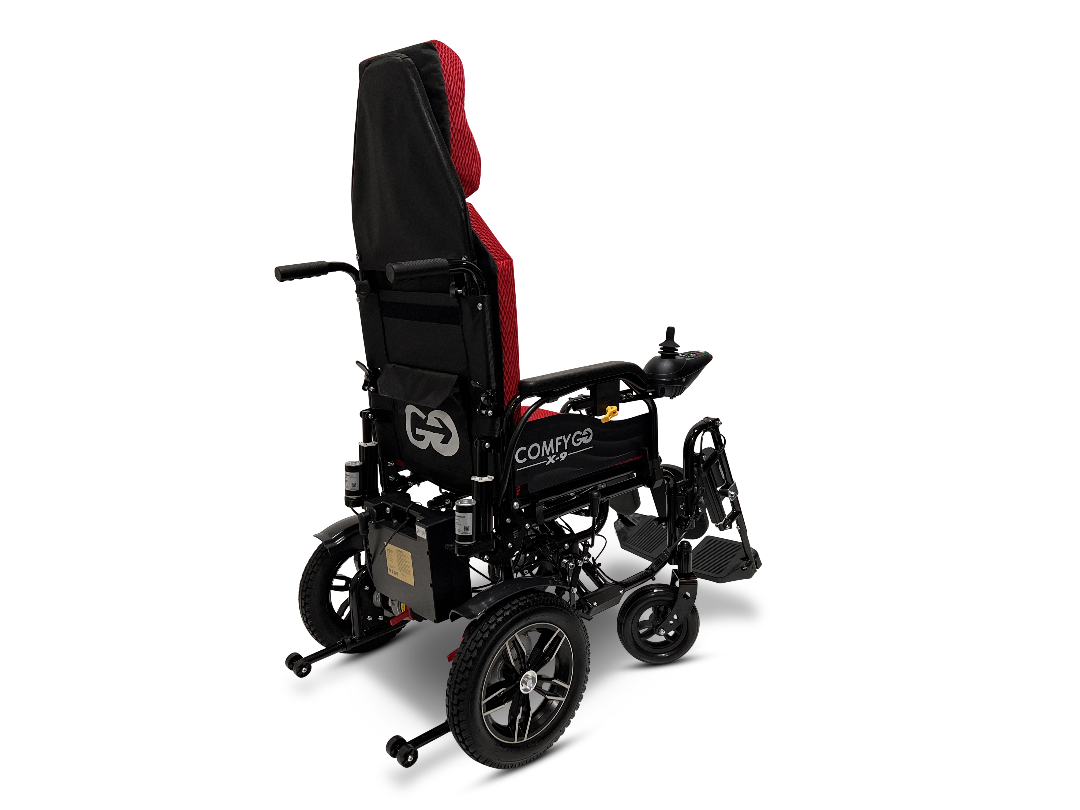 The ComfyGo X-9 Remote Controlled Powerchair - Automatic Reclining is showcased against a plain white background. This black and red electric wheelchair offers an adjustable headrest, sturdy wheels, joystick control, support bars, and ample side padding for advanced mobility.