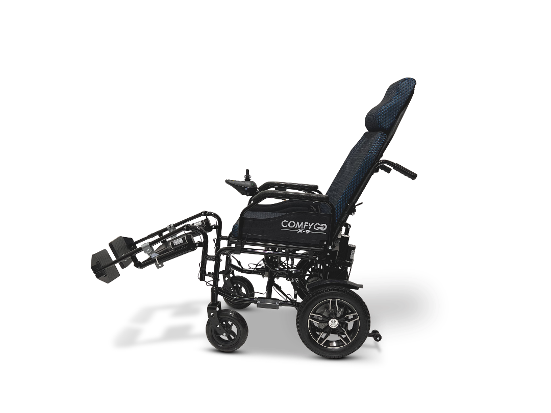 The ComfyGo X-9 Remote Controlled Powerchair offers a sleek black design with a reclining backrest and elevated footrests. It features modern wheels and remote-controlled functionality, displayed beautifully against a pristine white backdrop.