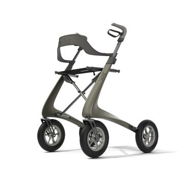 Experience stylish, comfortable mobility with the ByACRE Carbon Overland All-Terrain Rollator—a modern, lightweight walker featuring four large wheels, a sleek gray frame, ergonomic handles, and a curved backrest for support.