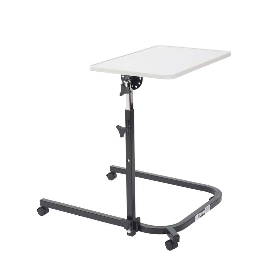 The Drive Pivot & Tilt Overbed Table features a white rectangular self-leveling tabletop and an adjustable black metal frame on wheels, ideal for hospitals or home care settings.